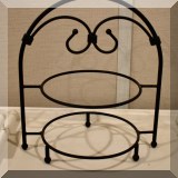 K31. Metal plate stand.